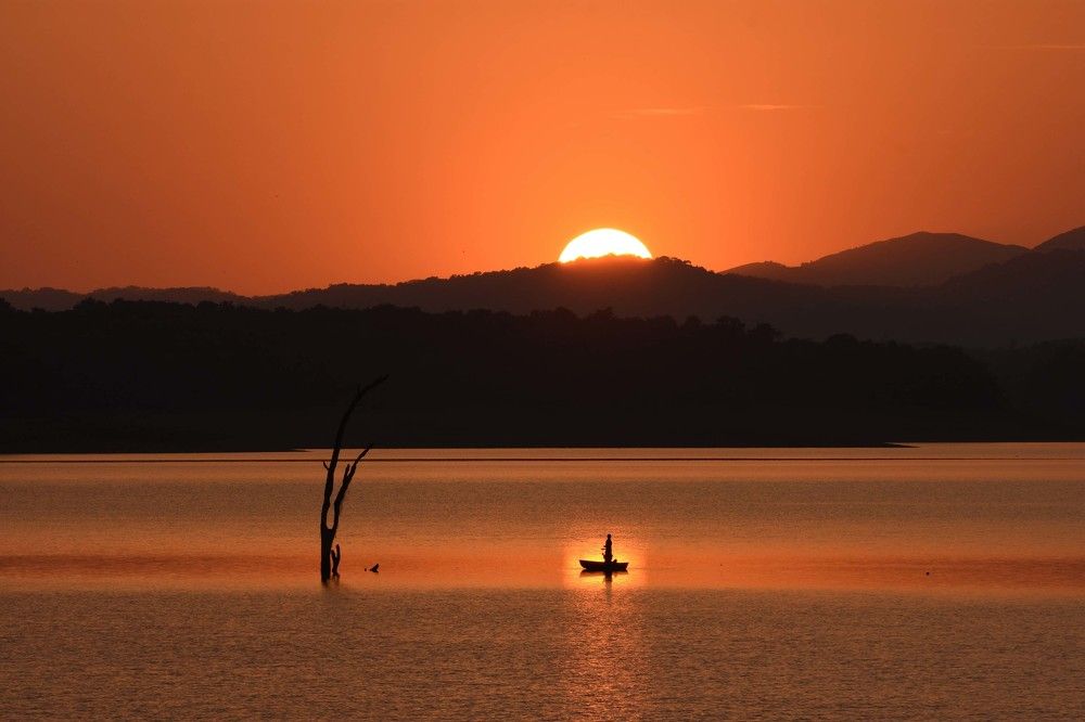 Fisher Man in front of the Sunset