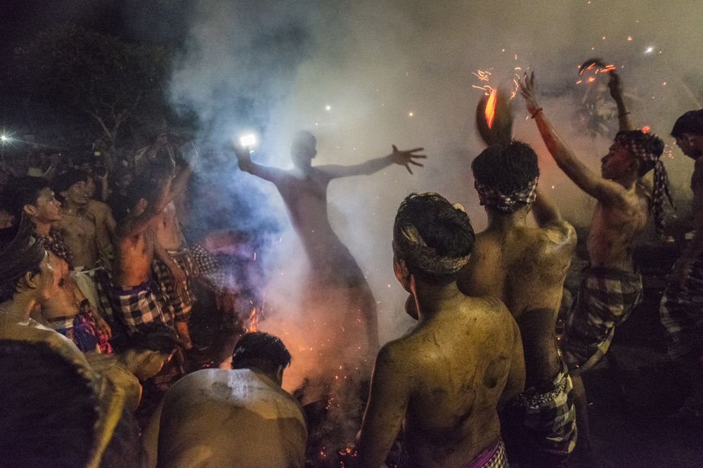 Celebrating with fire at Melasti Festival, Bali