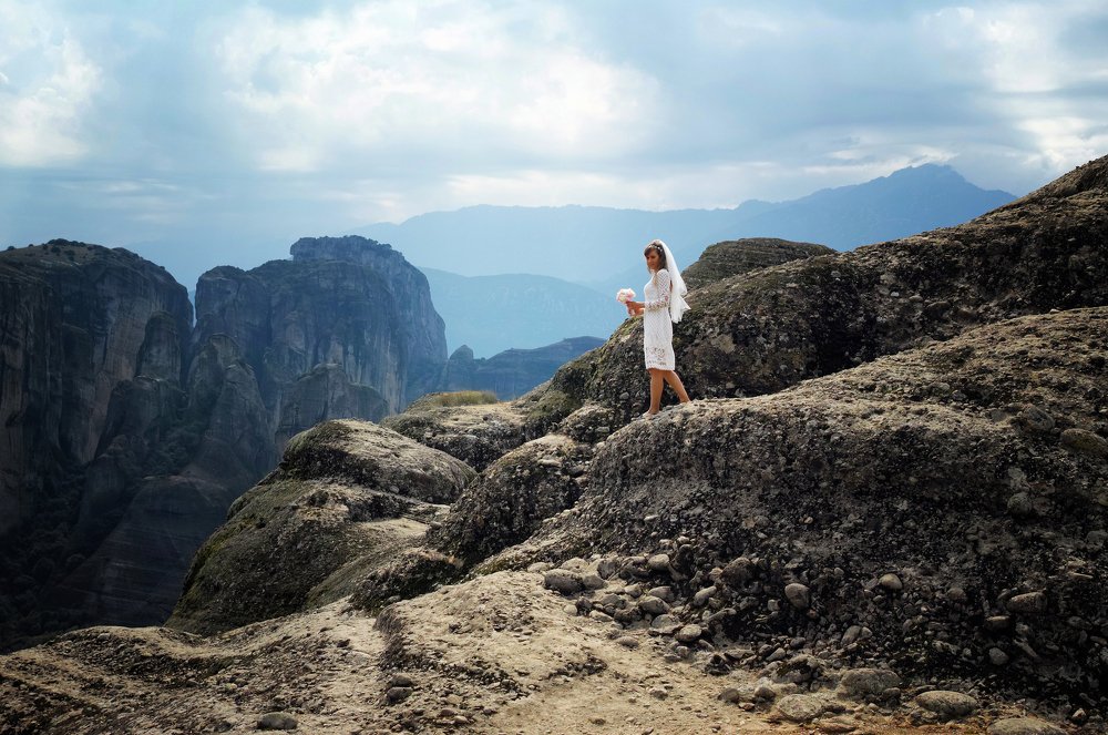 Young bride posing in mountains