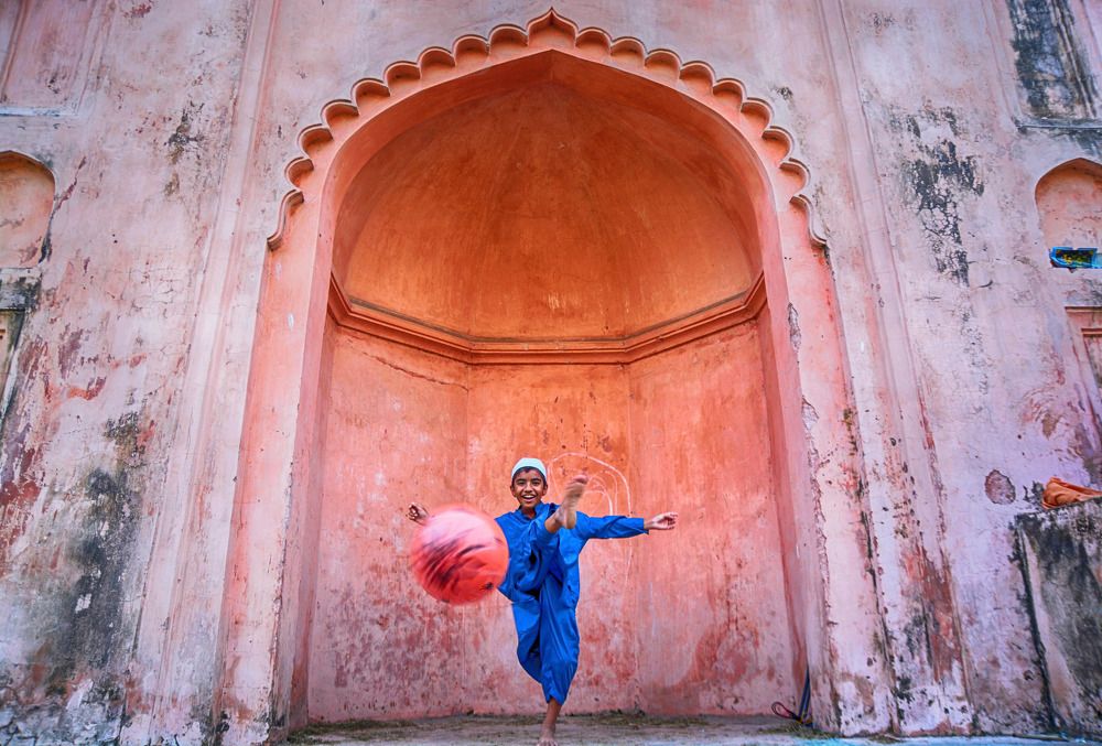 Islamic student plying football