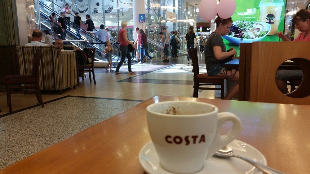 The cup of coffee.