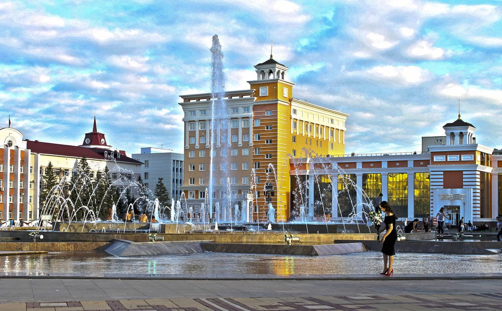 У городского фонтана.