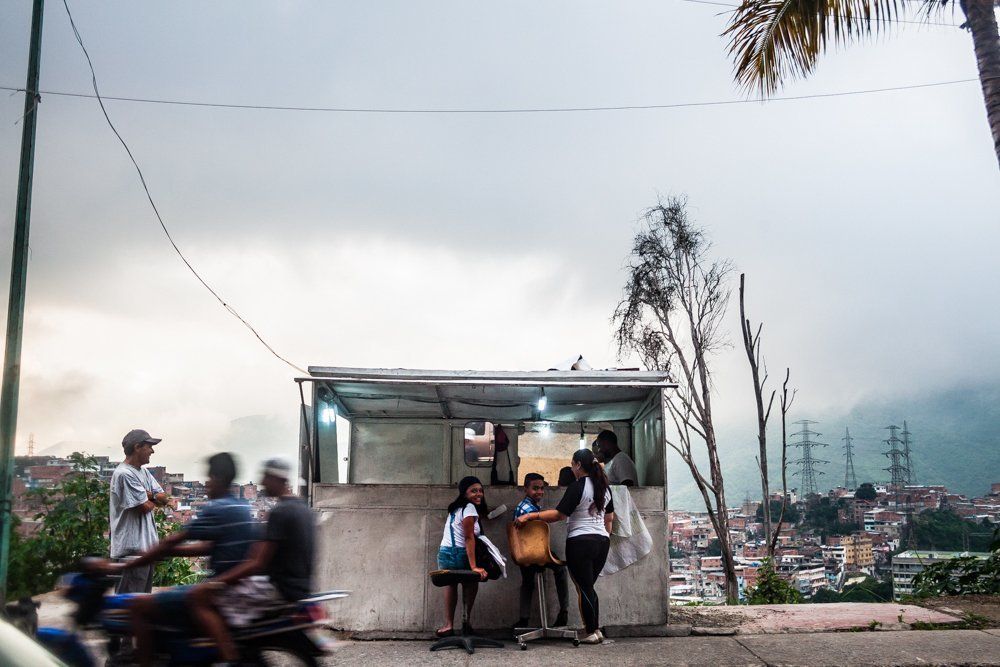 A hair cut at the edge of the favela