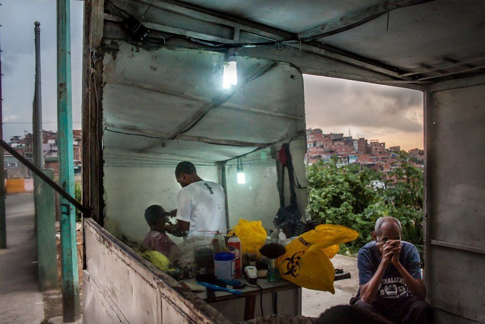 A hair cut at the edge of the favela