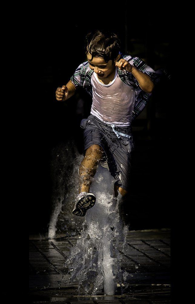 Kid Playing With Water