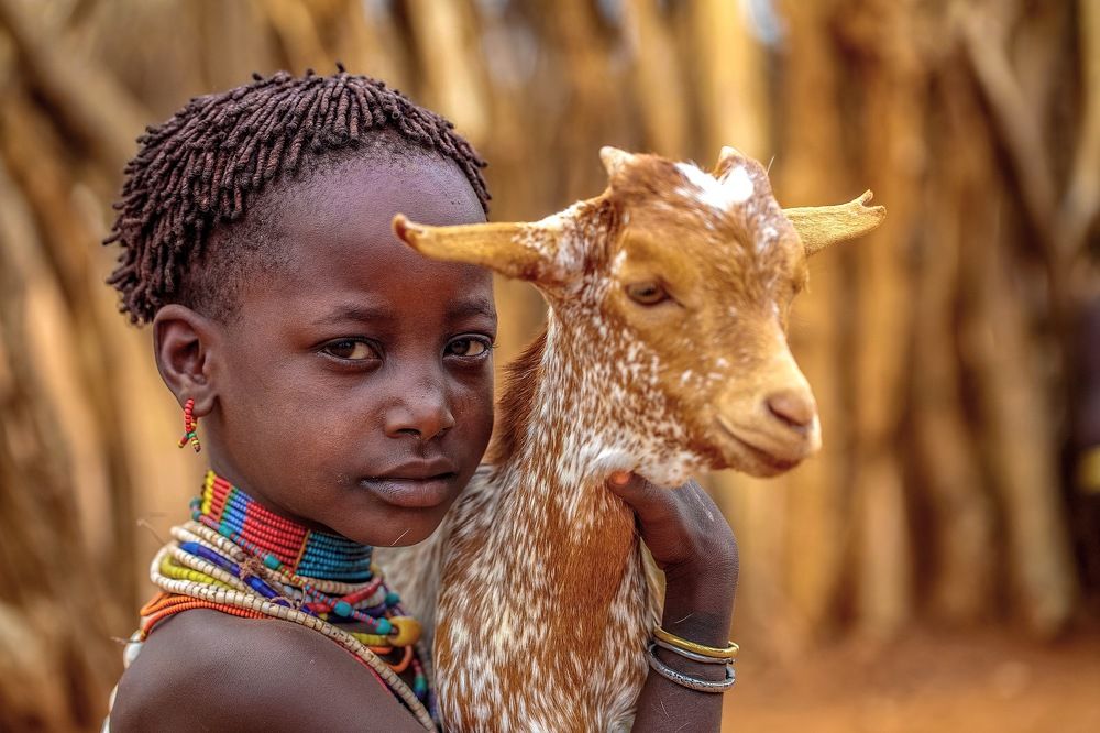 Hamar Girl and her pet Goat