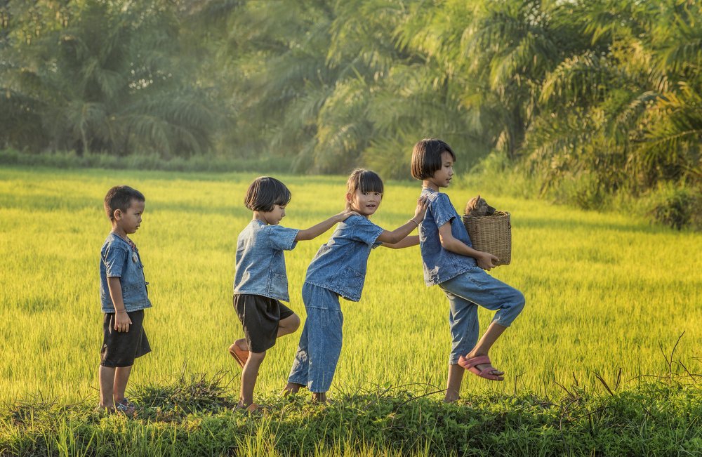 Happy childhood and friends in the Asian countryside.