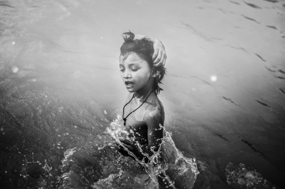 a kids playing on water
