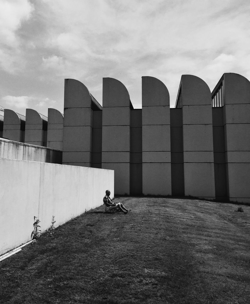 A Man Sunbathing At Bauhaus. Berlin, 2017