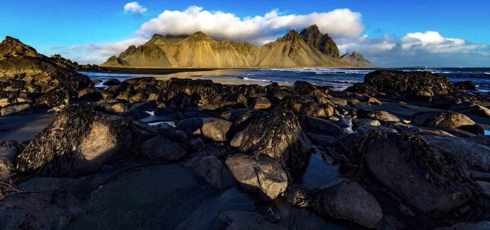 Orange Mountain and black sand beach