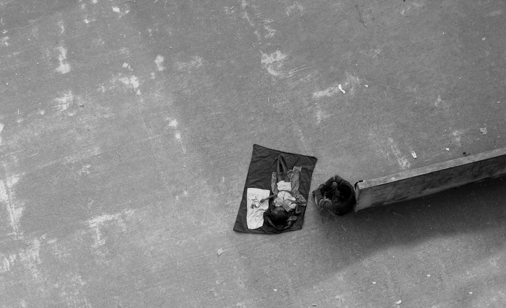 A Father Begging for Her Son