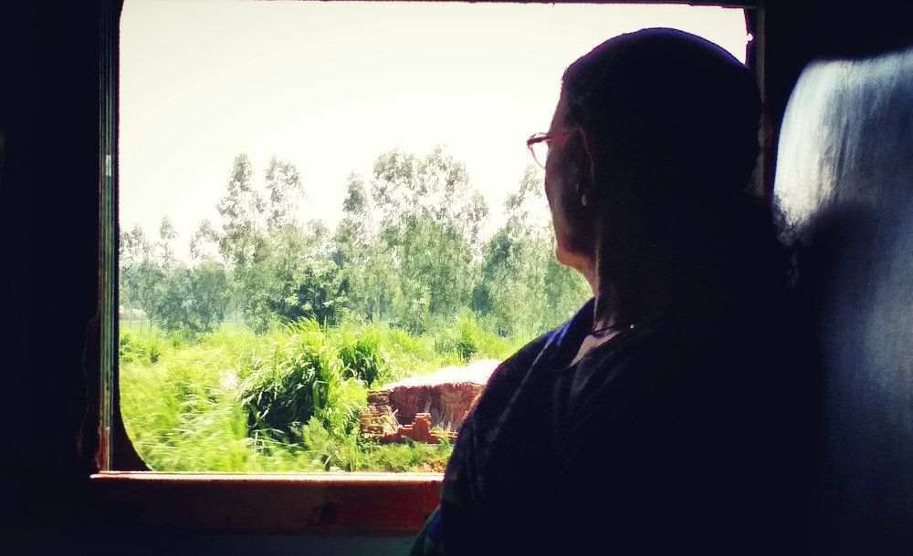 GramdMaa Seeking Out Of Train Window.