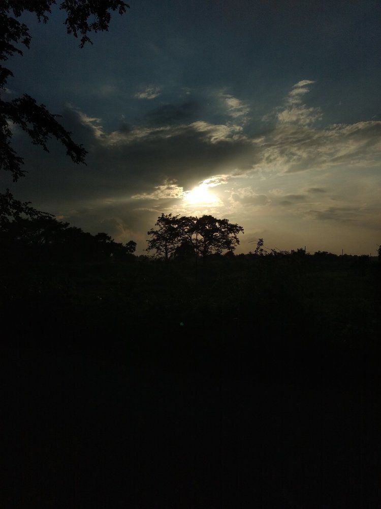 sunset behind clouds