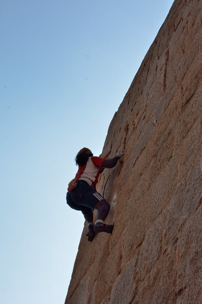 An acrobat climbing fort
