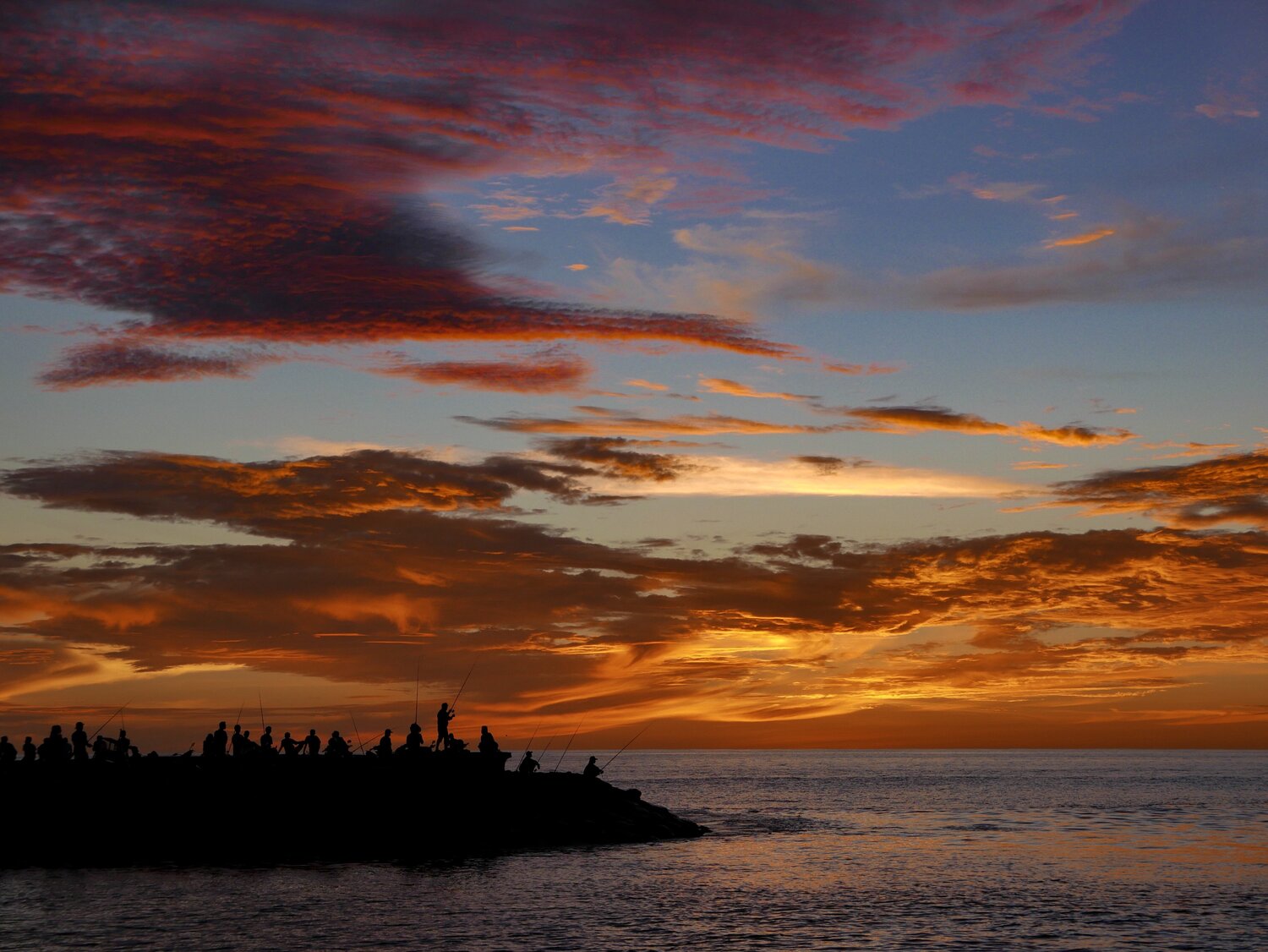 Sunset and the fisherman