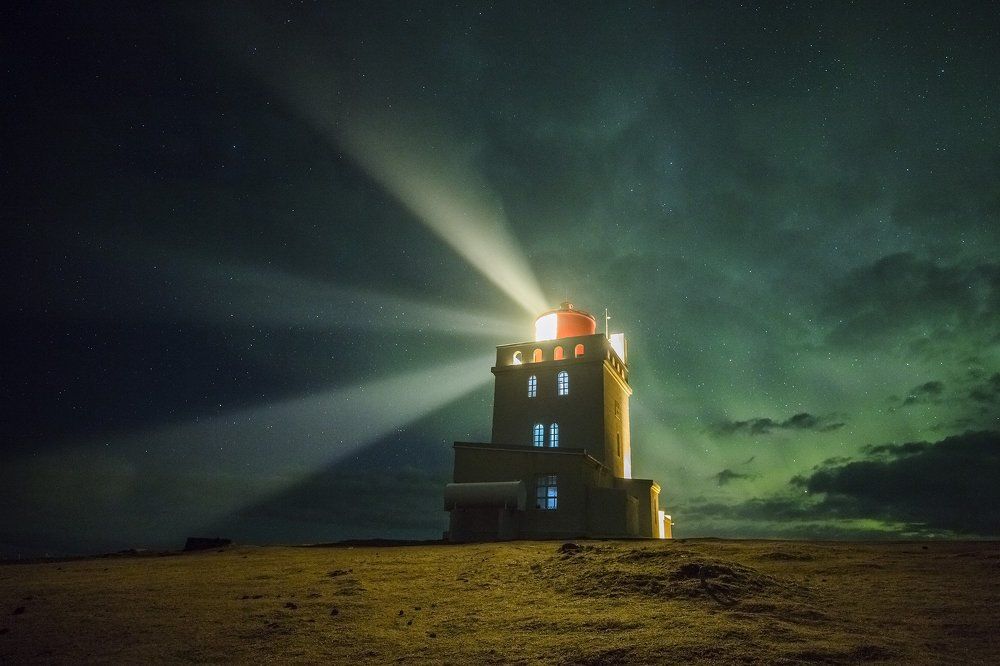 Lighthouse in green clouds. Iceland