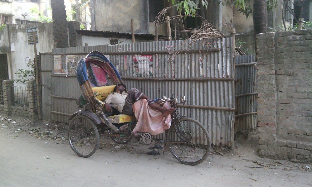 A tired Rickshaw puller