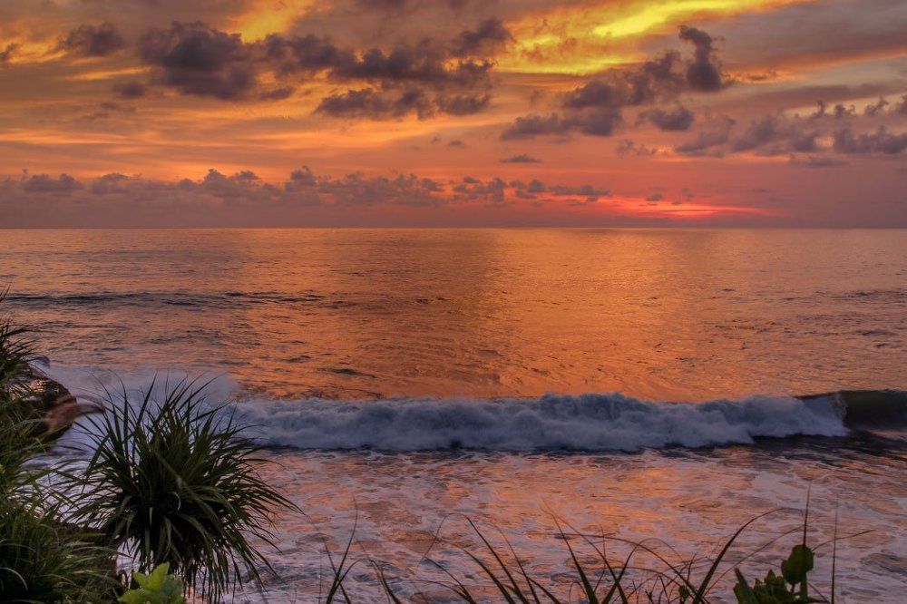 Playing the colors of the sunset over the ocean