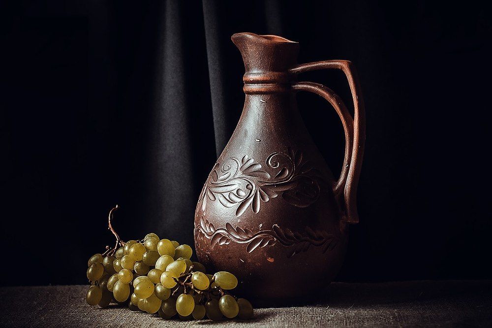 Pitcher and grapes