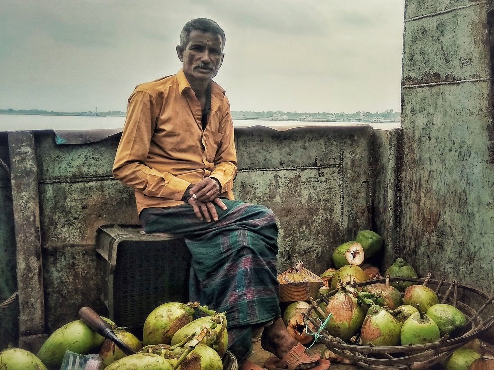 A coconut seller on ferry