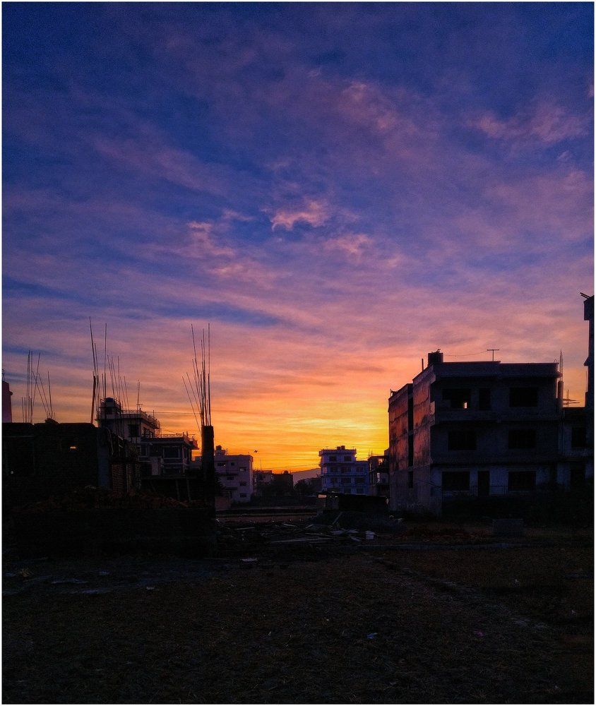 Sunrise behind building