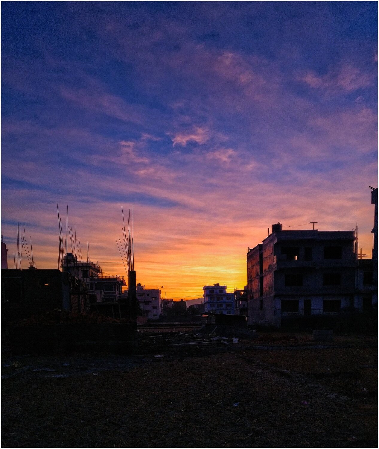 Sunrise behind building