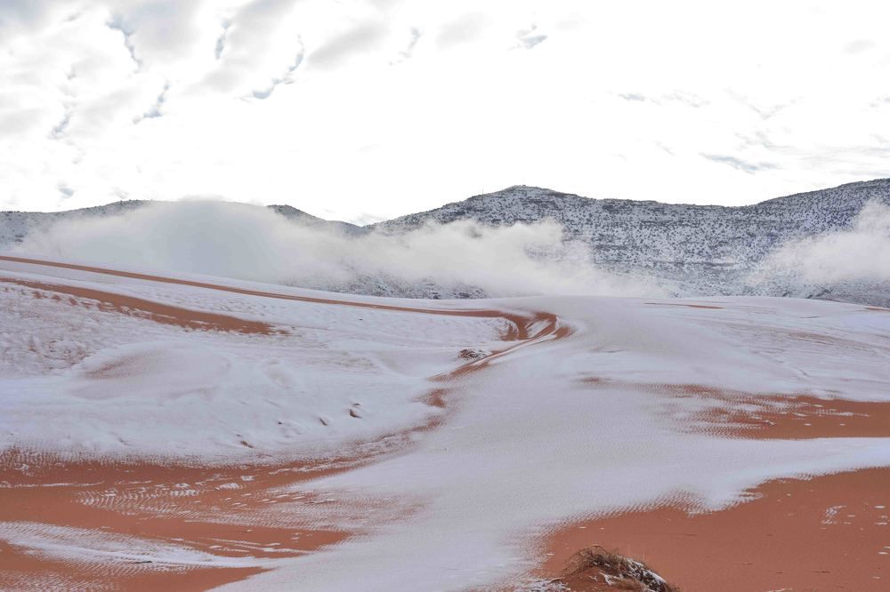 The desert town of Ain Sefra is surrounded by unexpected snow which is several inches deep