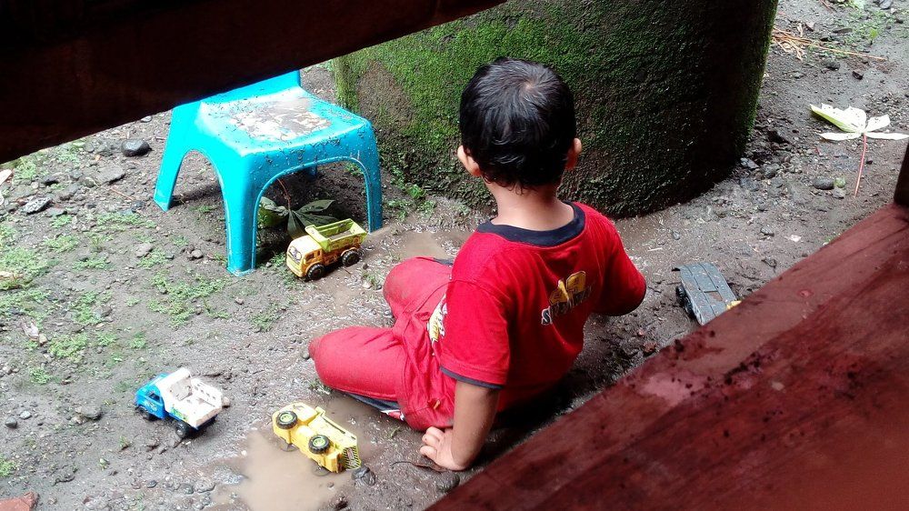 Activity of child in the rainy day