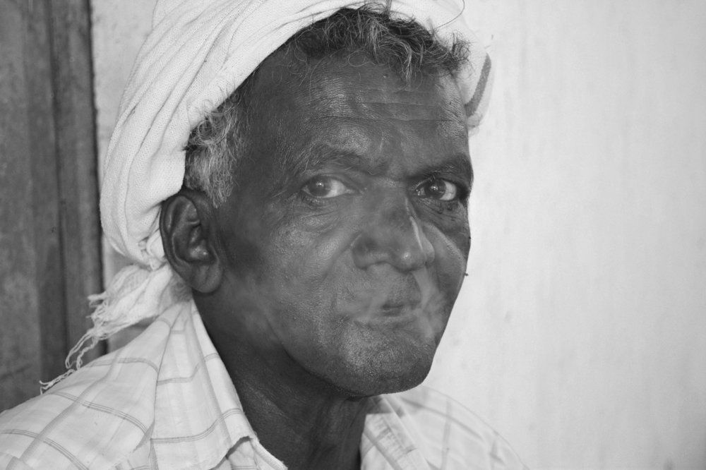 Old farmer  and  his own style smoke
