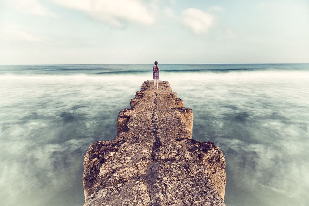 Dreamer girl on the pier - self-portrait