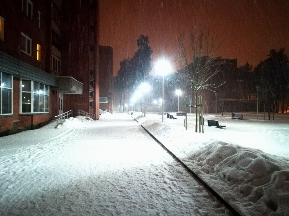 Snow in a night city