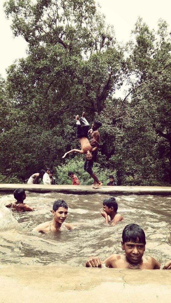 Children playing in a pond
