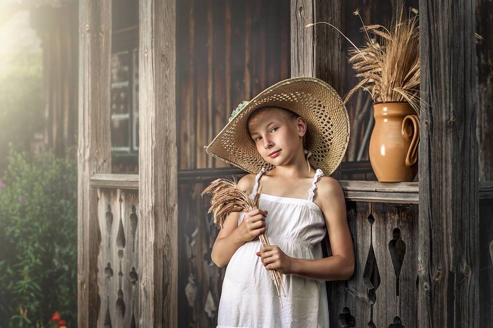 a girl with spikelets of rye