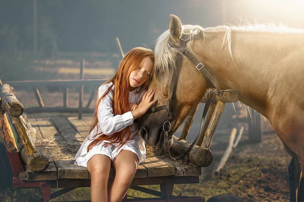 red-haired girl with a horse