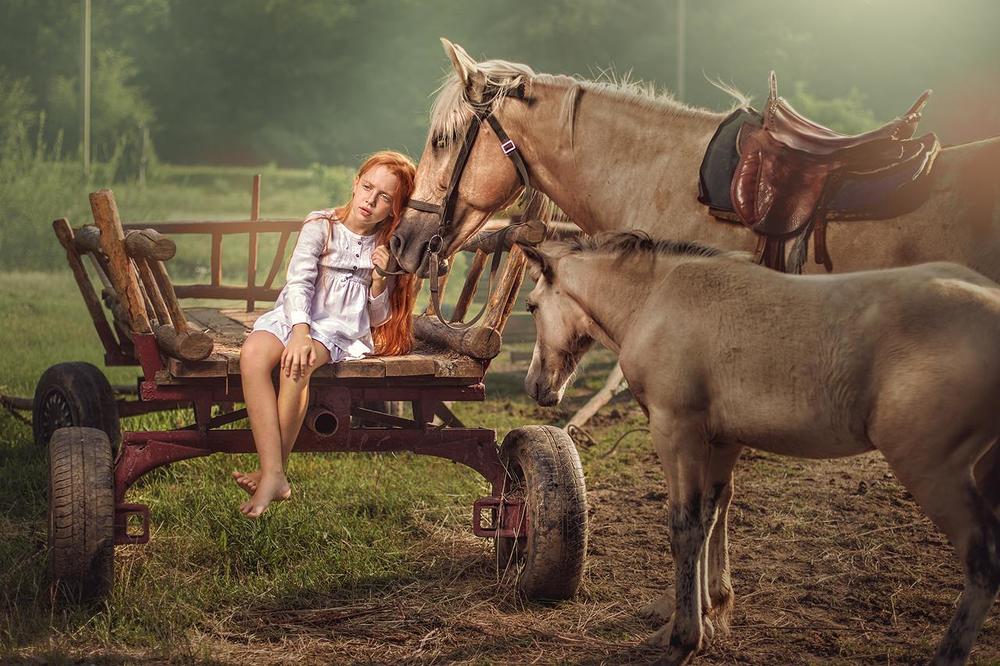 red-haired girl with a horse