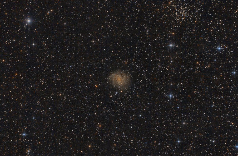 The Fireworks Galaxy NGC 6946 and open cluster NGC 6939