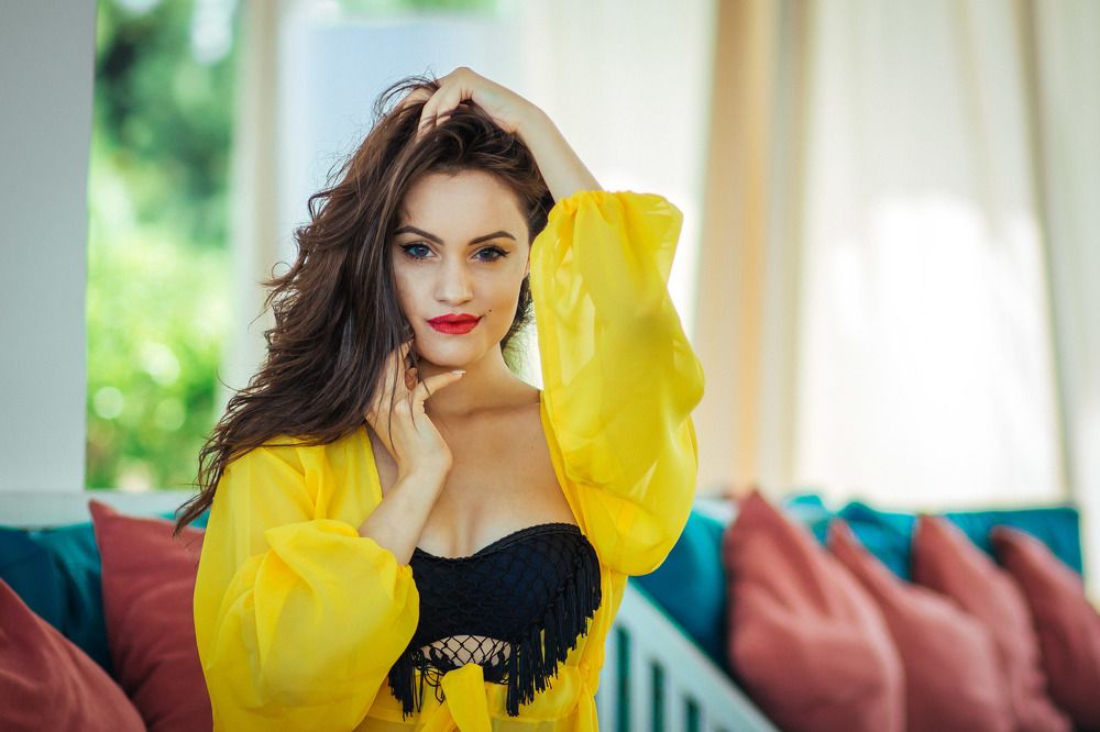 Beautiful girl in yellow dress and black bra