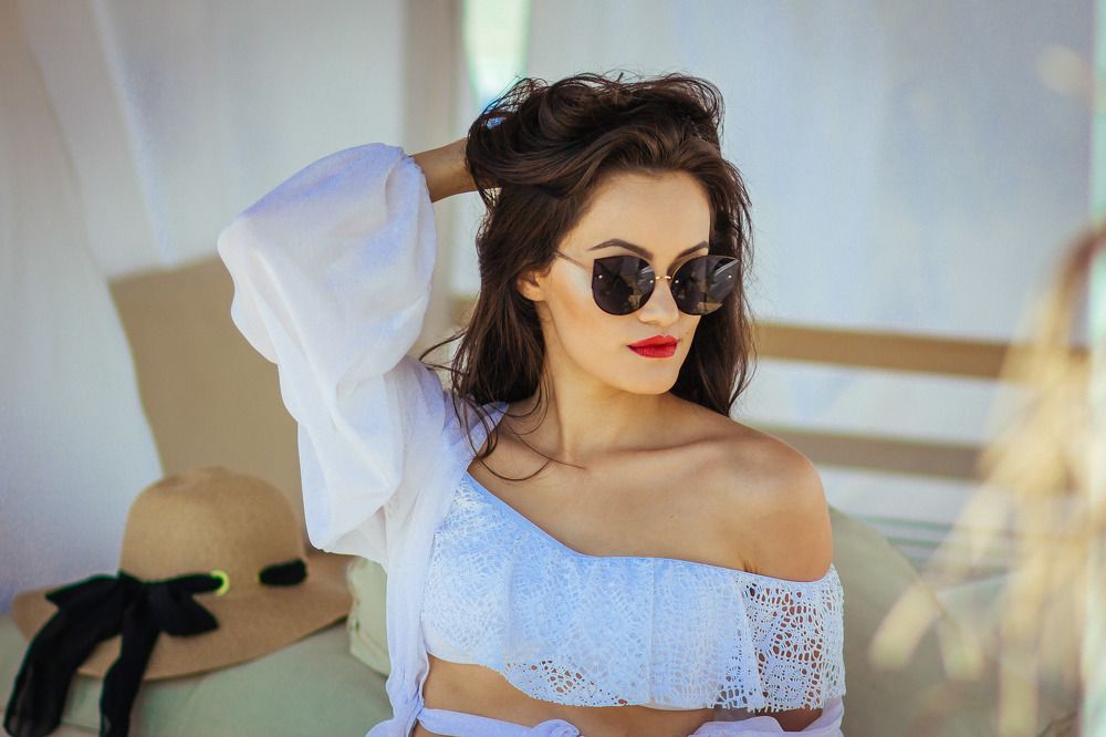 Sexy girl in white dress and sunglasses