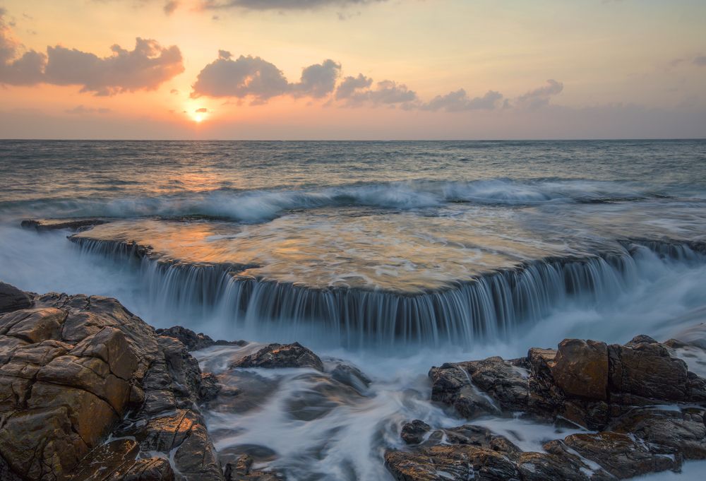 Hang Rai sea waterfall in sunrise
