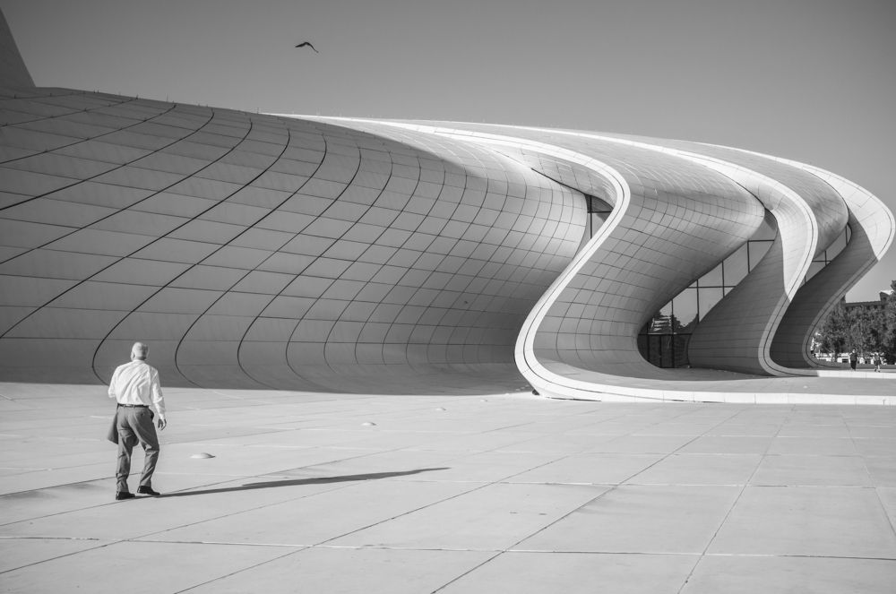 Old man in modern city