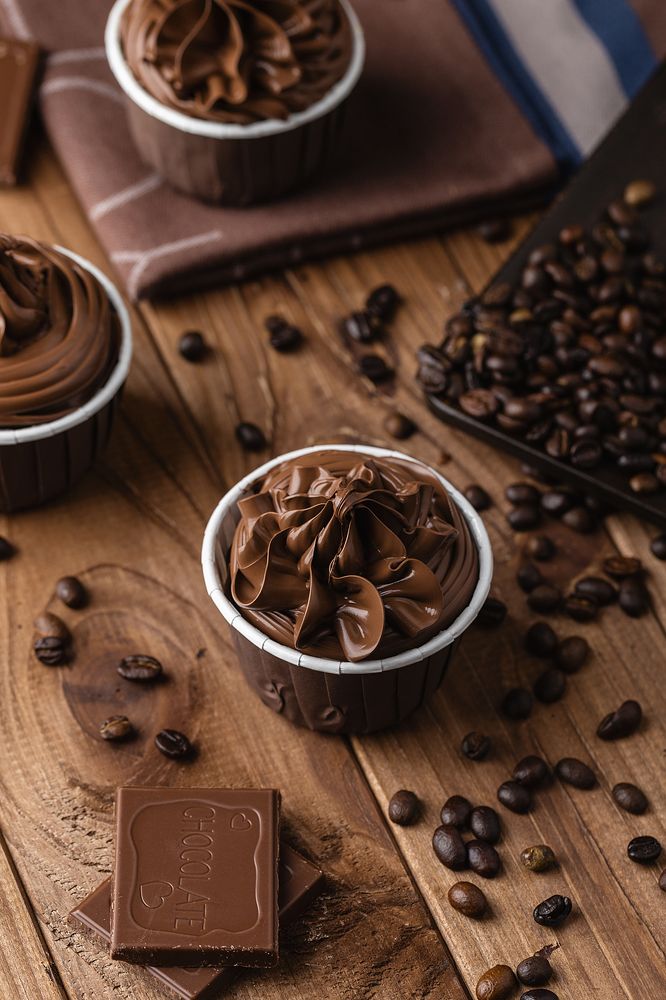 Homemade chocolate cupcakes on wooden background
