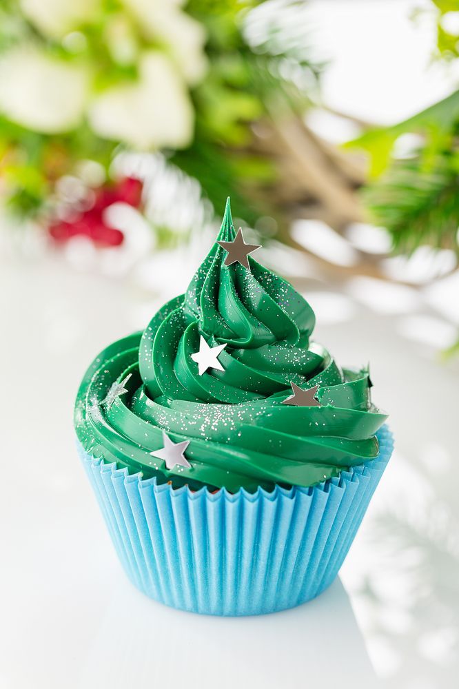 Green christmas cupcake with festive decorations