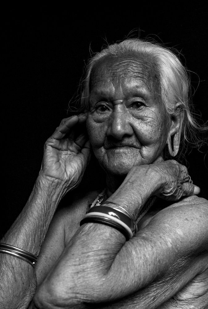 An old Stieng women with her stretched earlobes