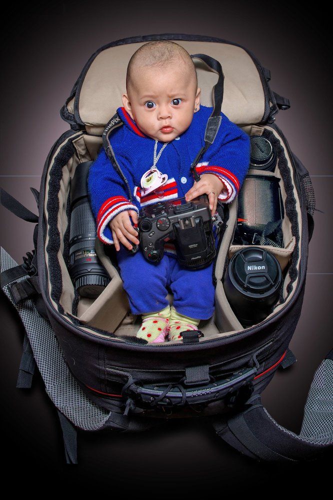 Baby in camera bag