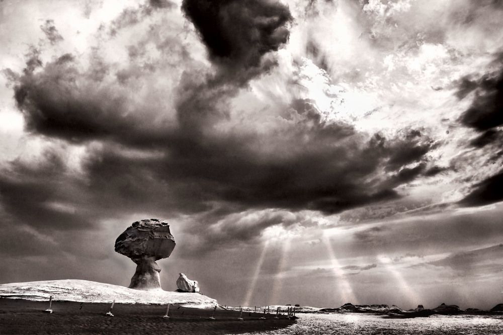 Dark clouds looming over the white desert
