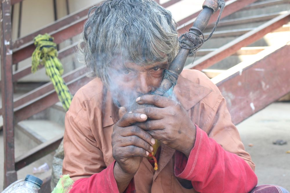 man smoking hukka