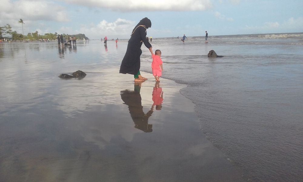 Mother and Son In a Beach