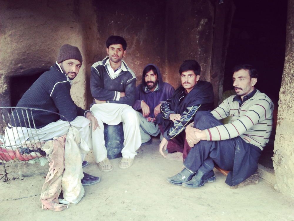 Some friends setting in village on shop