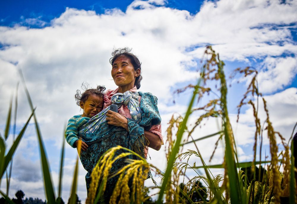 Mother and child with mobile.