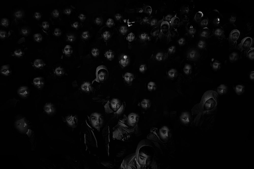 In the light of the light, in the back of the light, the illuminated face procession